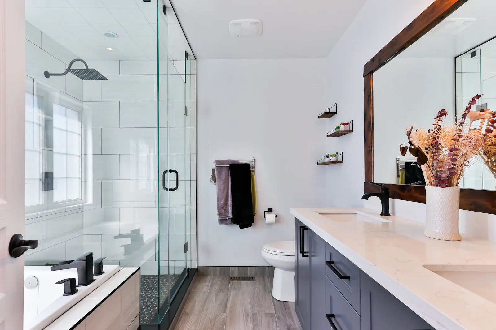 A spotless, bright bathroom with polished vanity and walk-in shower, professionally cleaned